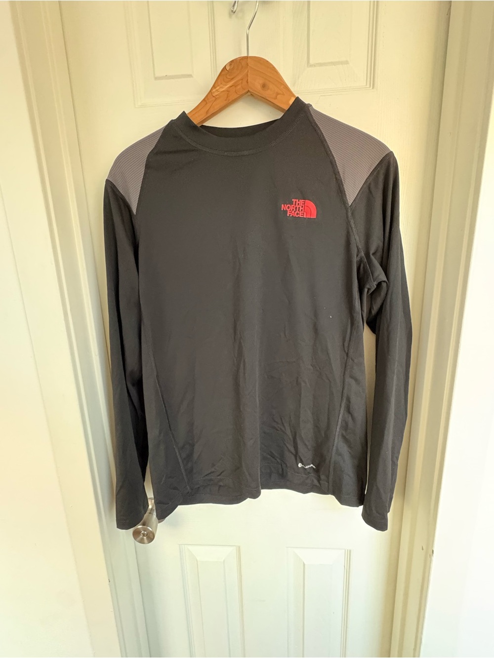 The North Face Men’s Long Sleeve Crew in Charcoal with Red Logo